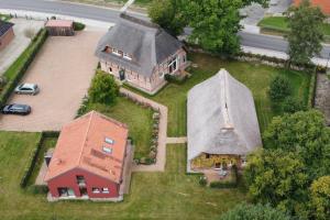 an aerial view of a house with a roof at HofGut Bockelkathen Apartment 8 in Lüdersburg
