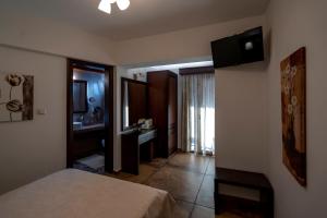 Postel nebo postele na pokoji v ubytování Hotel Meteora