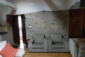 Posezení v ubytování Casa rural en Asturias a orillas del río Narcea puerta de Somiedo