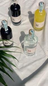 a group of three bottles of perfume on a table at Santa Lucia Maccarese - Residenza Agricola in Maccarese