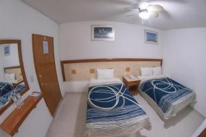 Postel nebo postele na pokoji v ubytování Hotel Niza Zona Piel