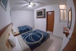 Postel nebo postele na pokoji v ubytování Hotel Niza Zona Piel