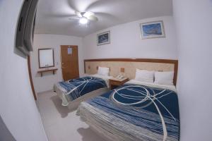 Postel nebo postele na pokoji v ubytování Hotel Niza Zona Piel
