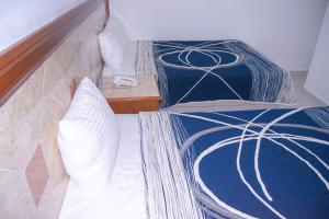 Postel nebo postele na pokoji v ubytování Hotel Niza Zona Piel