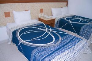 Postel nebo postele na pokoji v ubytování Hotel Niza Zona Piel