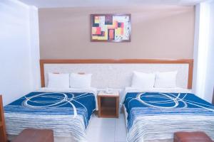Postel nebo postele na pokoji v ubytování Hotel Niza Zona Piel