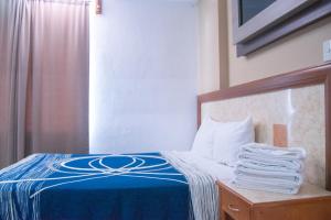 Postel nebo postele na pokoji v ubytování Hotel Niza Zona Piel