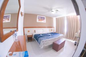 Postel nebo postele na pokoji v ubytování Hotel Niza Zona Piel