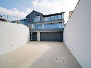 a view of a house from the street at Megizzy in Polzeath