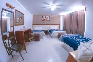 Postel nebo postele na pokoji v ubytování Hotel Niza Zona Piel