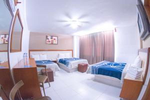 Postel nebo postele na pokoji v ubytování Hotel Niza Zona Piel