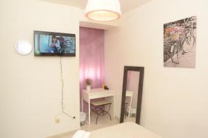 Televízia a/alebo spoločenská miestnosť v ubytovaní Habitacion a 300 metros del centro historico