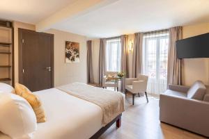 Postel nebo postele na pokoji v ubytování Best Western Plus Hôtel Belfort Centre Gare