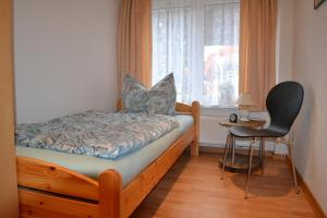 Кровать или кровати в номере Ferienwohnung Ditz III