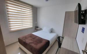 Voodi või voodid majutusasutuse Bayit Tov Circunvalar Hotel toas