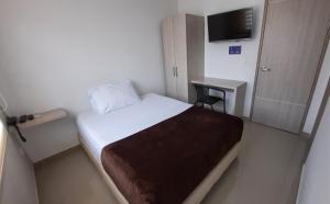Voodi või voodid majutusasutuse Bayit Tov Circunvalar Hotel toas