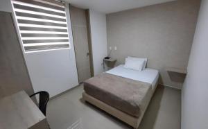 Voodi või voodid majutusasutuse Bayit Tov Circunvalar Hotel toas