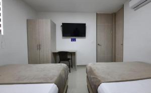 Voodi või voodid majutusasutuse Bayit Tov Circunvalar Hotel toas