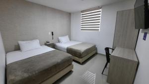 Voodi või voodid majutusasutuse Bayit Tov Circunvalar Hotel toas