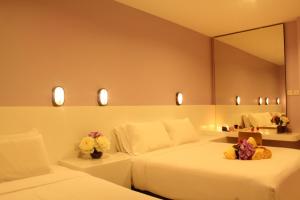 Katil atau katil-katil dalam bilik di Song Service Apartment formerly known as Jinhold Service Apartment