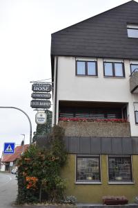 a street sign in front of a building at Gasthof Rose in Reutlingen