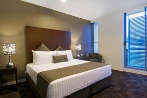 Łóżko lub łóżka w pokoju w obiekcie Hotel 115