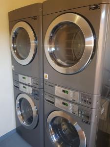 two washing machines are stacked next to each other at Whyalla Country Inn Motel in Whyalla
