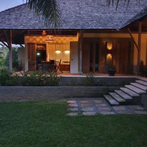 a house with a pathway in front of it at Tropical villa in the Bangsare hills near Pattaya in Bang Sare +8 photos