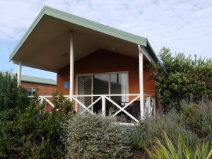 a house with a large window on the side of it at Discovery Parks - Pambula Beach in Pambula