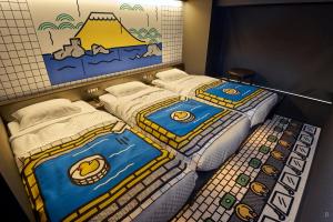 Postel nebo postele na pokoji v ubytování HOTEL TAVINOS Kyoto