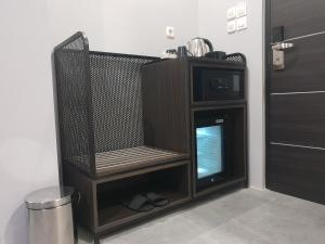 En tv och/eller ett underhållningssystem på Sambina Prime by Danapati