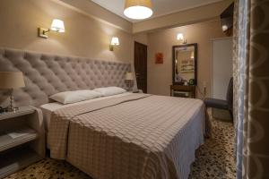 Postel nebo postele na pokoji v ubytování Hotel Meteora