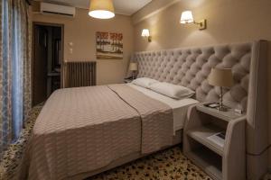 Postel nebo postele na pokoji v ubytování Hotel Meteora
