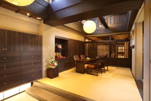 a lobby with a table and a dining room at Wakasa Annex in Nara