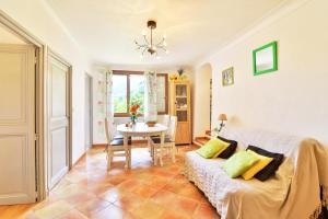 a living room with a couch and a table at La Maison De Noelie - stunning house for rent in Le Bar-sur-Loup