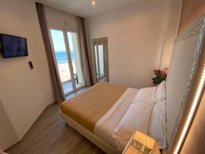 Postel nebo postele na pokoji v ubytování Hotel Caesar Paladium