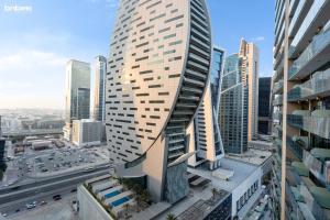 a tall building in the middle of a city at bnbmehomes - Merano Tower in Dubai