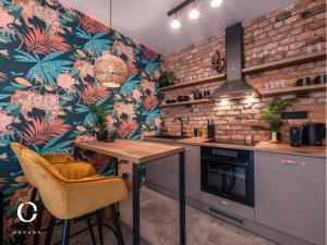 a kitchen with a table and chairs in a room at JUMBO APARTMENTS in Rajecké Teplice