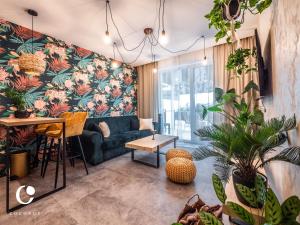 a living room with a couch and a table at JUMBO APARTMENTS in Rajecké Teplice