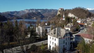 a view of a town with a castle on a hill at Apartment in the heart of Bled with views in Bled