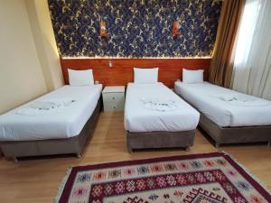 Postel nebo postele na pokoji v ubytování Otantik Hotel + 24 fotografií