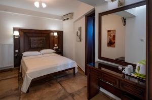 Postel nebo postele na pokoji v ubytování Hotel Meteora