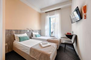 Кровать или кровати в номере А1 Отель Санкт-Петербург