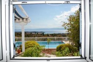 Fotografia z galérie ubytovania Iron Hill Pool Villa - Amazing Sunset & Sea View v destinácii Porto Heli