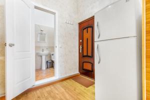 a kitchen with a refrigerator and a sink at Best Apartment in the city centre in Odesa +49 photos