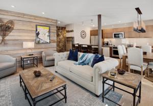 a living room with a couch and a table at Sun Vail 14A condo in Vail
