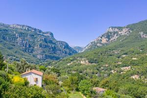 a view of a valley with mountains in the background at Listed Accomodation 4 At 300m river 800m village and 30mn Nice Cannes Antibes in Le Bar-sur-Loup