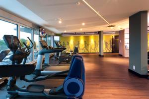 a gym with treadmills and cardio equipment in a building at Steigenberger Parkhotel Braunschweig in Braunschweig