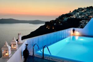 a pool with a view of the amalfi coast at Aeolos Art & Eco Suites Adults Only in Imerovigli