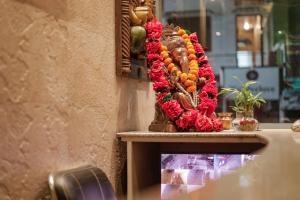 a display of flowers on a table in a store at Hotel Grand Galaxy in Rishīkesh